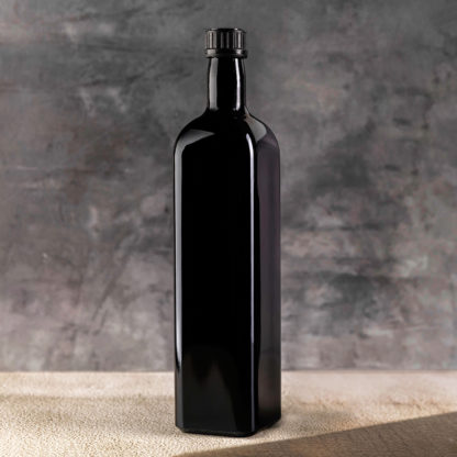 butelka na olej z lini Castor z fioletowego szkła biofotonicznego Miron o pojemności 1 litr we wnętrzu